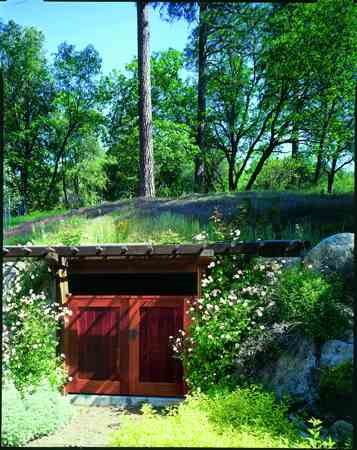 The “bunker” adjacent to the house entry contains a fire hydrant connected to the water stored for emergencies and fire-fighting, and for the building and garden sprinkler systems.